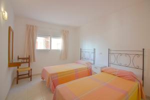 Postel nebo postele na pokoji v ubytování Apartamento Calpe Mediterráneo 1º línea