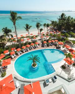 an aerial view of a resort with a swimming pool and the beach at Boca Beach Residence hotel in Boca Chica