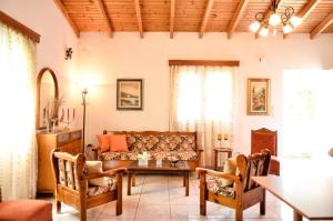 a living room with a couch and a table at Doloi garden house in Málta