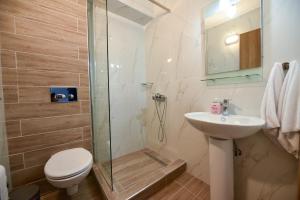 A bathroom at Lamda Deluxe Apartments