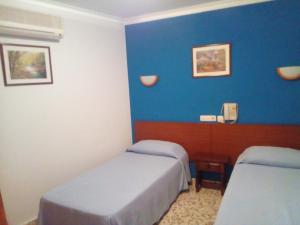 Voodi või voodid majutusasutuse El Faisan C&R Hotel toas