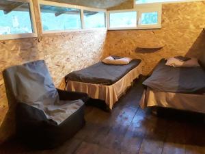 Ένα ή περισσότερα κρεβάτια σε δωμάτιο στο Snoveli Kazbegi