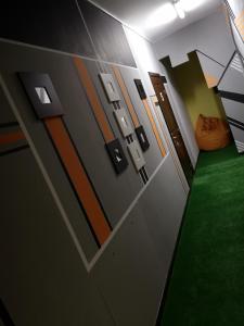 a room with a hallway with a green floor at DanHostel in Warsaw