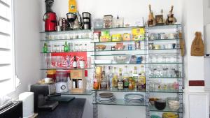 a refrigerator filled with lots of food and drinks at Mapi des Iles - chambre chez l'habitant in Le Gosier