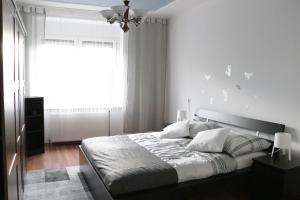 Postel nebo postele na pokoji v ubytování The Lakehouse Villa Neusiedl am See Wienerstraße 8