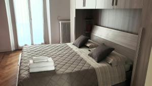 a bedroom with a large bed in a room at cesena3 plus in Milan