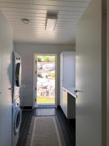 a hallway with a door leading to a bathroom at Villa Kalliorinne in Jyväskylä