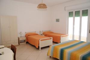 Postel nebo postele na pokoji v ubytování B&B il Giardinetto Pachino