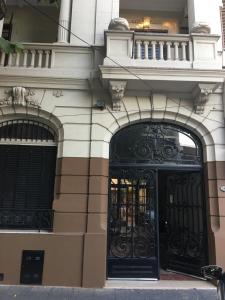 a building with black doors on the side of it at TSEliot Bed&Breakfast in Banfield