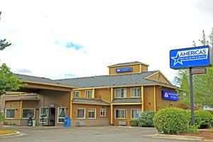 a building with a sign in front of it at Americas Best Value Inn & Suites-Forest Grove/Hillsboro in Forest Grove