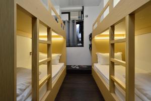 Letto o letti in una camera di Atlas Hostel & Backpackers