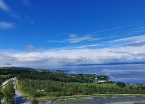 a view of a road and a body of water at Stav Hotel in Malvik