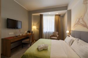 Postel nebo postele na pokoji v ubytování Renion Hills Hotel