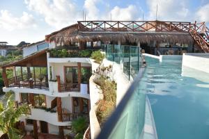 an image of a resort with a swimming pool at Spirit Holbox in Holbox Island