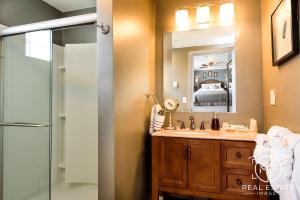 a bathroom with a shower and a sink and a mirror at Bouchard Restaurant & Inn in Newport