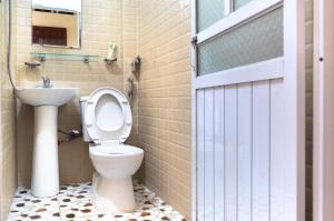 a bathroom with a toilet and a sink at Minh Quang homestay in Ba Be +38 photos