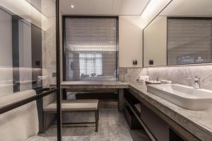 Koupelna v ubytování Joya Shanghai Xujiahui Hotel