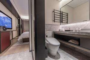Koupelna v ubytování Joya Shanghai Xujiahui Hotel + 37 fotografií