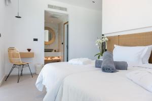 Posteľ alebo postele v izbe v ubytovaní Enorme Ammos Beach Resort
