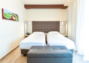 Voodi või voodid majutusasutuse Bhotel toas
