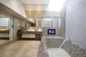a bathroom with a sink and a bath tub at Region Motel in Lukang