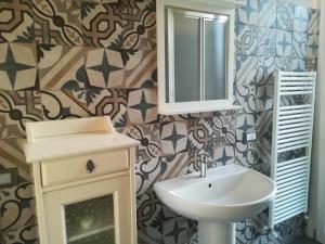 a bathroom with a sink and a mirror at Braschi 8 B&B in Zola Predosa +70 photos