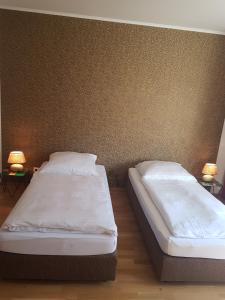 Ein Bett oder Betten in einem Zimmer der Unterkunft Hotel Stern