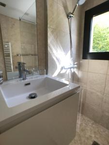 a bathroom with a white sink and a mirror at Mer et Provence in La Cadière-dʼAzur +26 photos