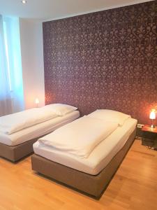 Ein Bett oder Betten in einem Zimmer der Unterkunft Hotel Stern