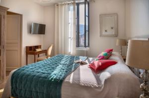 Ένα ή περισσότερα κρεβάτια σε δωμάτιο στο La Maison De Siloe