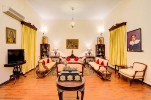 A seating area at WelcomHeritage Shivavilas Palace, HAMPI