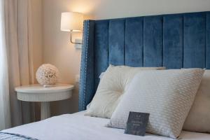 Voodi või voodid majutusasutuse Gian Paul Hotel toas