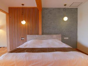Letto o letti in una camera di ISANA Resort