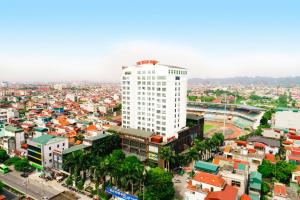 an overhead view of a city with a tall white building at The Vissai Hotel in Ninh Binh