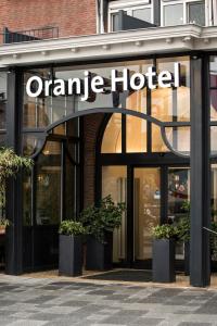 a store front with a large window at Oranje Hotel Leeuwarden in Leeuwarden