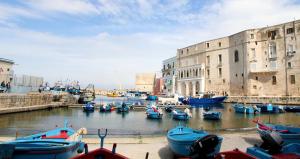 a group of boats are docked in a harbor at Casa Donnalby in Monopoli