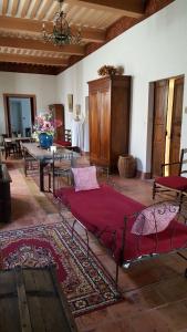 a bedroom with a bed in a room with a rug at Château Moussoulens in Moussoulens