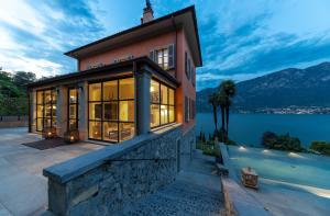 a house with a view of the water at Villa Mojana Bellagio in Oliveto Lario