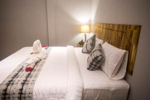 Postel nebo postele na pokoji v ubytování @HOsTEL PHANGAN