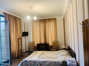 Postel nebo postele na pokoji v ubytování Hotel Amigo II