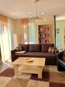 a living room with a couch and a coffee table at Ferienwohnung Usedomresidenz in Ostseebad Karlshagen