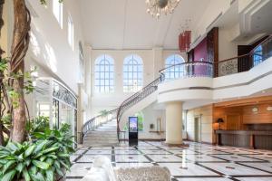 a lobby of a building with a staircase at Lakeshore Hotel Hsinchu in Hsinchu City