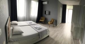 Voodi või voodid majutusasutuse Hotel FLEUR DE LIS toas