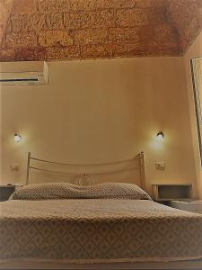 Postel nebo postele na pokoji v ubytování TORRE SUL MARE affittacamere Ugento