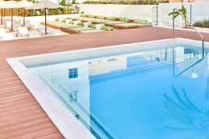 The swimming pool at or close to HM Dunas Blancas