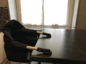 an umbrella sitting on top of a table at Au chat qui danse, T2 tout confort Intra-Muros in Saint Malo