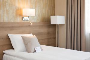 Postel nebo postele na pokoji v ubytování Z-Hotel Business & Spa + 37 fotografií
