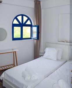 A bed or beds in a room at Muses seaside Villas
