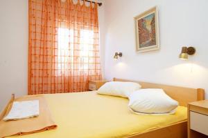Postel nebo postele na pokoji v ubytování Apartments Delic