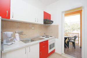 Kuchyň nebo kuchyňský kout v ubytování Apartments Delic
